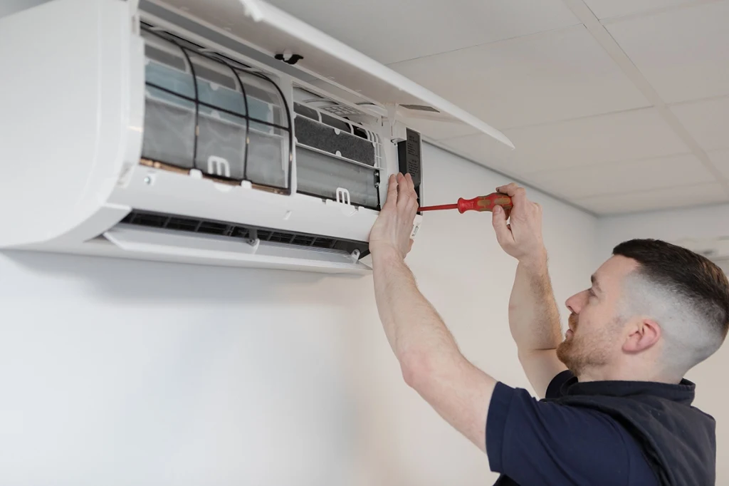HVAC technician servicing indoor air filter and mini split blower wheel in Aviara Carlsbad