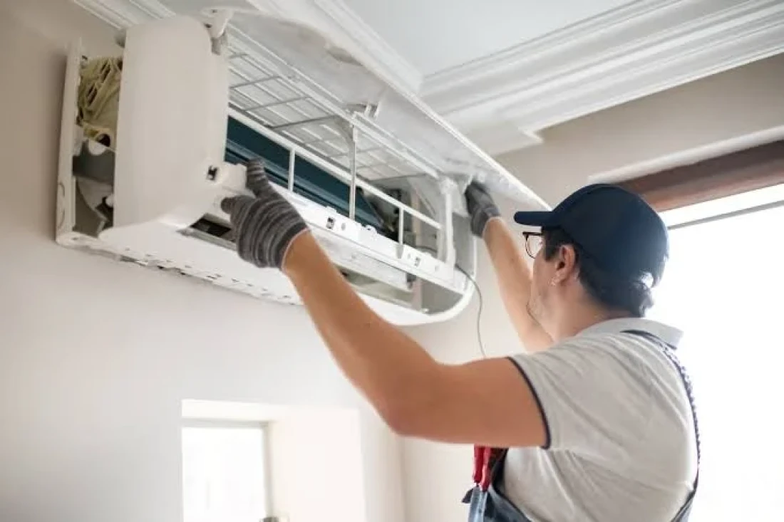 Technician installing indoor ductless mini-split unit in Cardiff-by-the-Sea