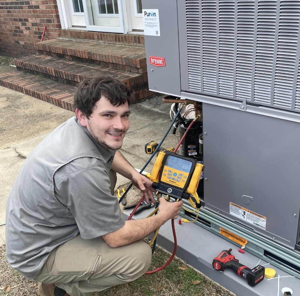 Certified HVAC technician testing Bryant Puron cooling system diagnostics in Carlsbad residential property